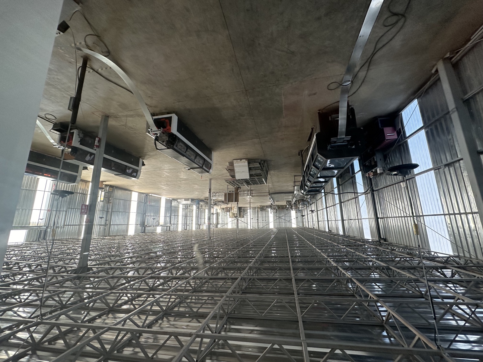 Master steel coils and the slitting line on the Cal Steel production floor.