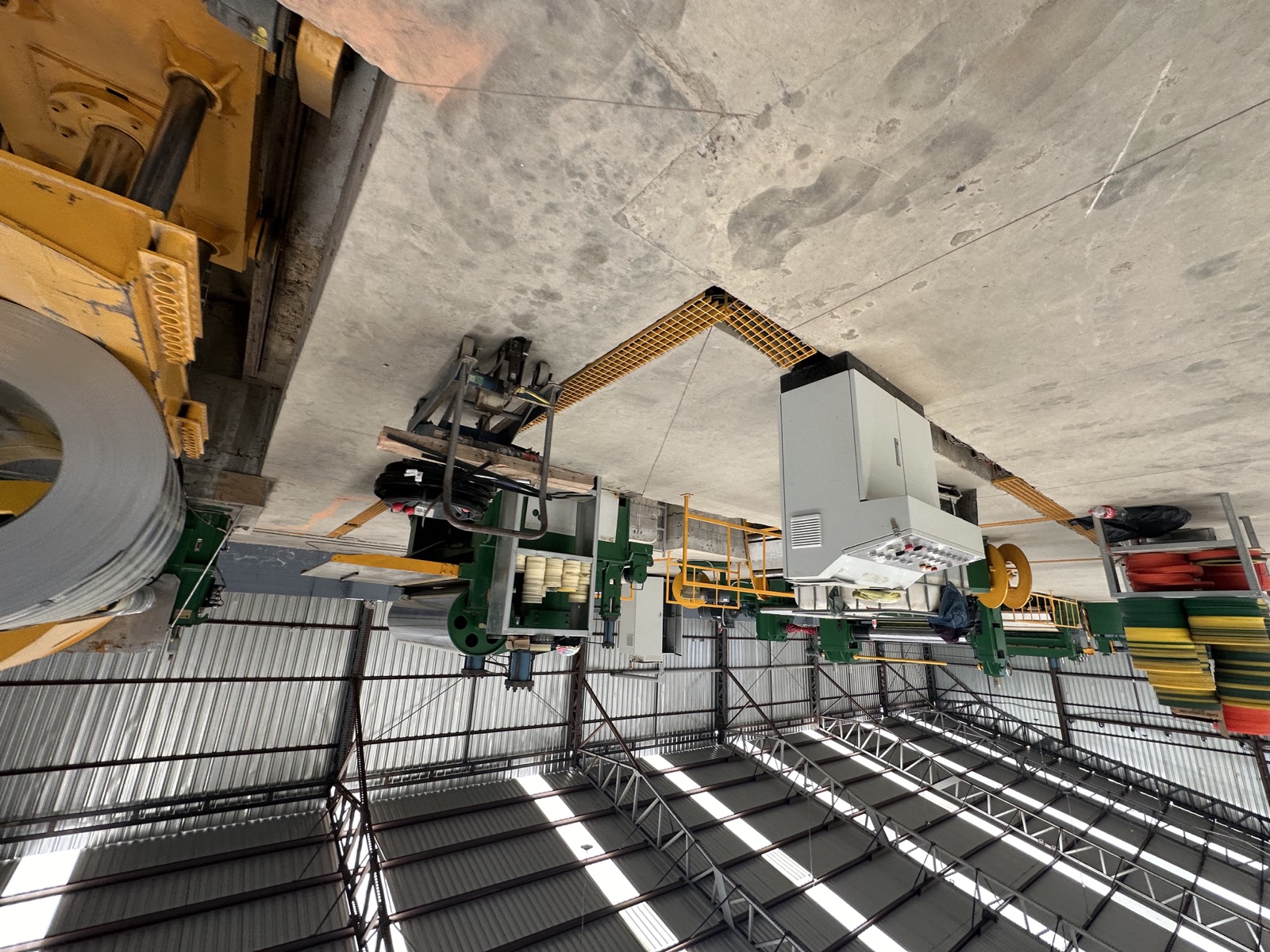 Overhead view of the roll-forming lines on the production floor.