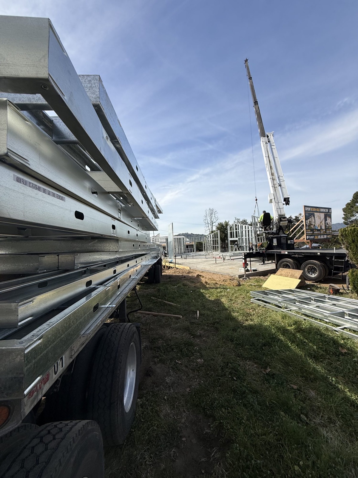 The steel kit of parts arriving on a flatbed at 480 W Palm