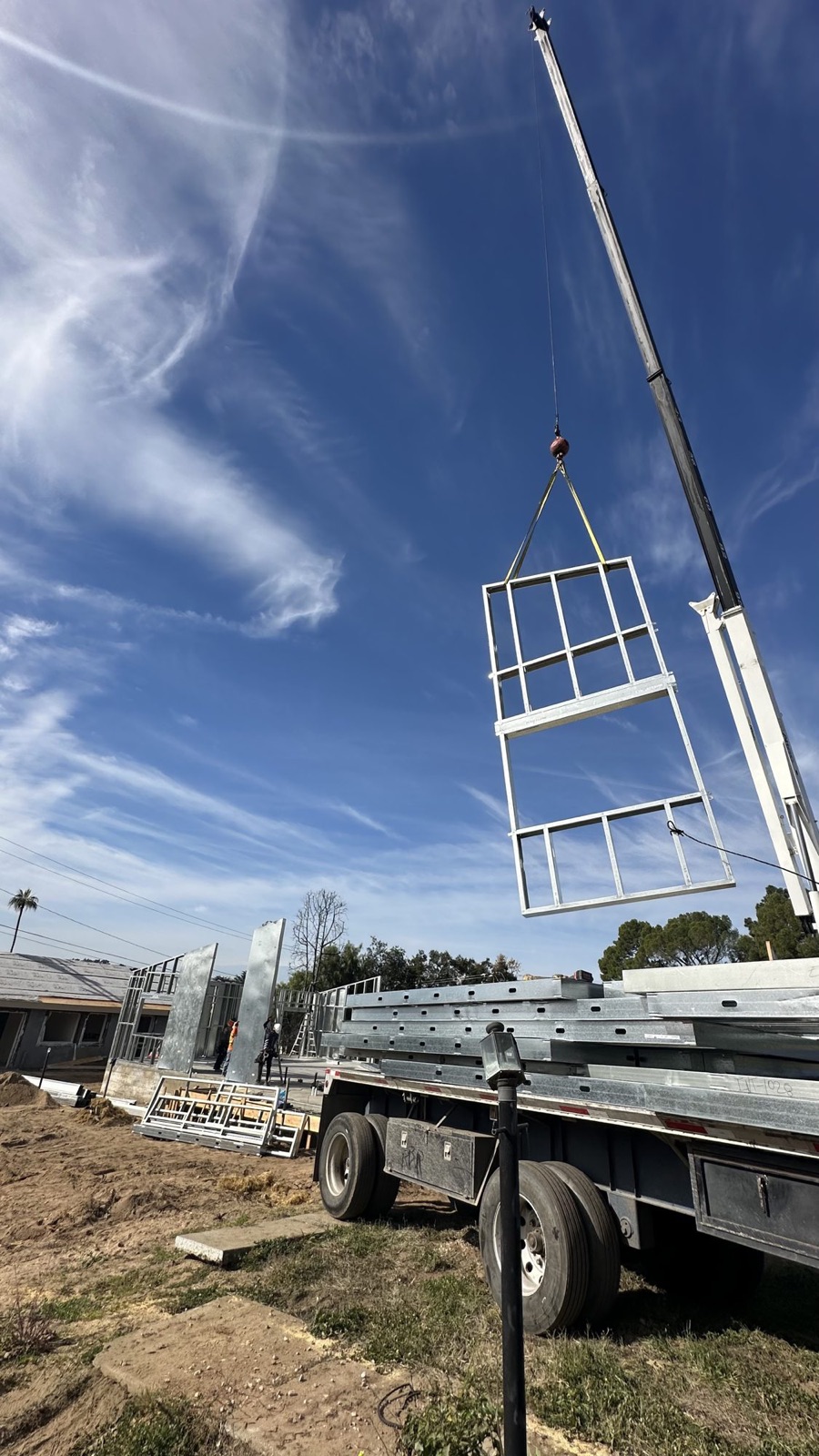 A light gauge steel wall panel craned against the sky at 480 W Palm
